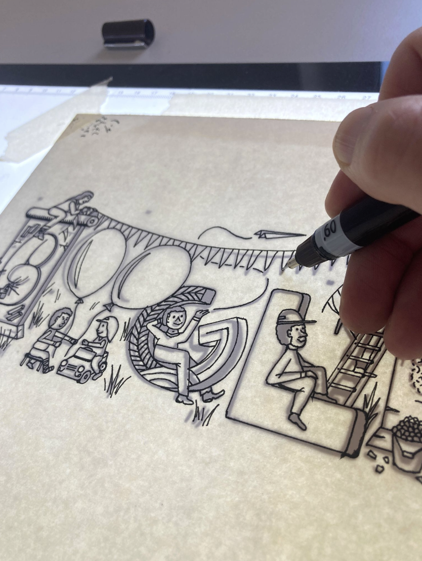 Photograph of the Doodle being illustrated on a backlit drawing table 