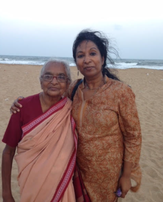 A photograph of Meena and her mother on a beach.