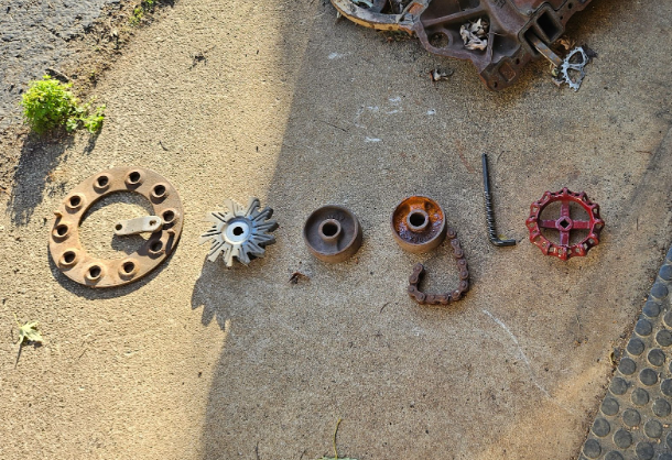 A photo of metal parts arranged to spell out the word 