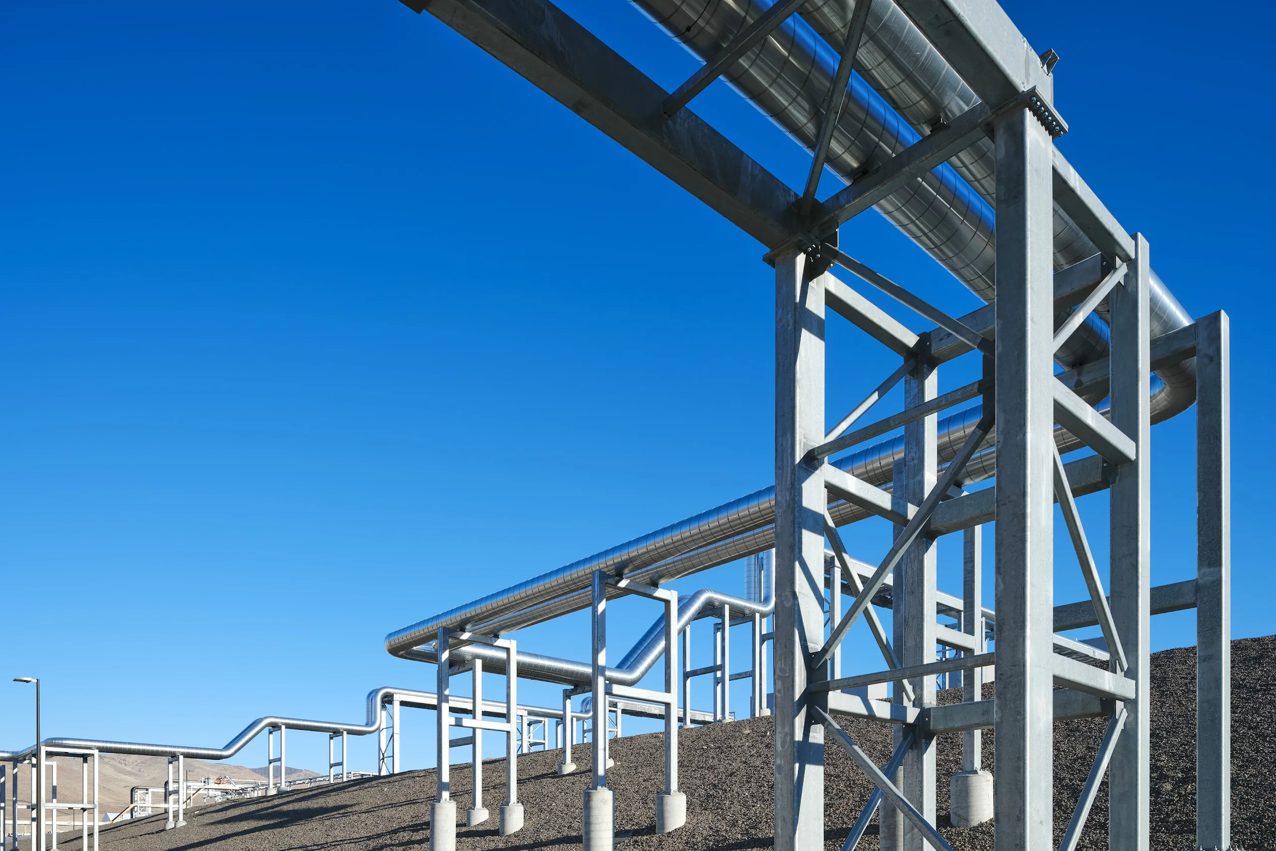 An exterior photograph of cooling pipes in Storey County, Nevada, data center campus, bringing water to and from the data center to help cool our servers.