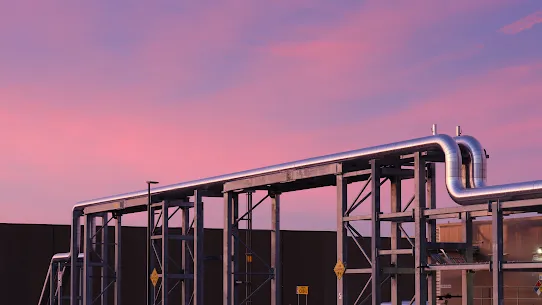 An exterior photo of cooling pipes during a Nevada sunset at Google's Storey County data centers.