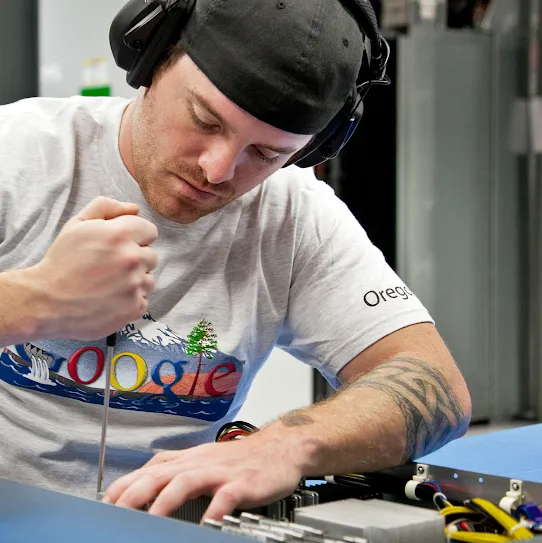 A Google facilities technician maintains the infrastructure of the critical systems inside a Google data center.