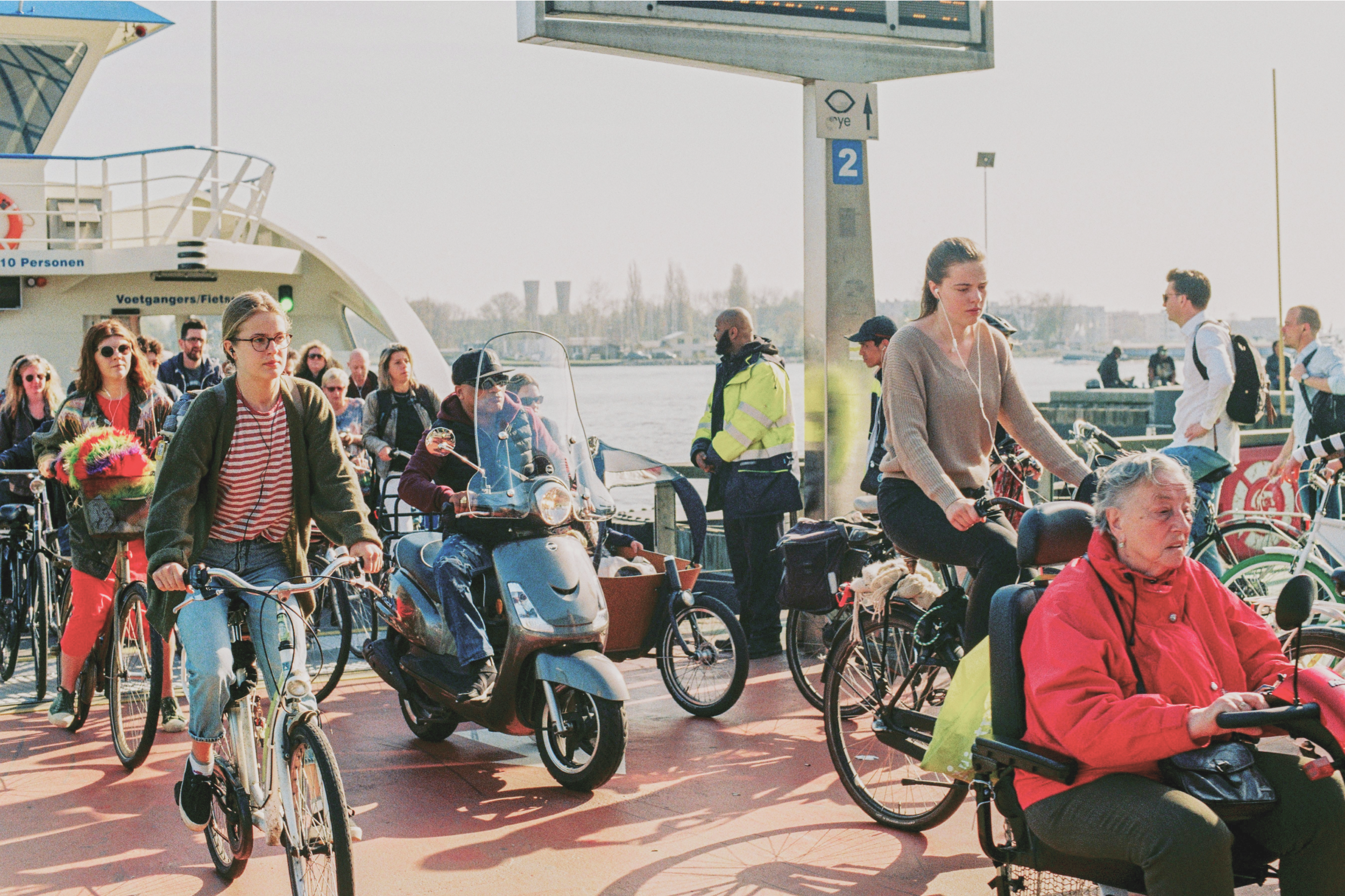 People riding bicycles on road during daytime