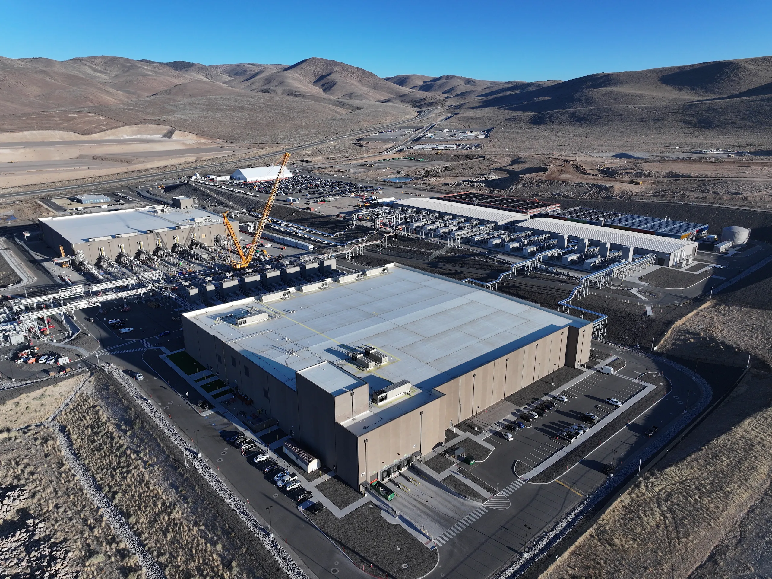 An aerial photograph looking southwest toward the Flowery Mountains of two Storey Country data centers and our gCUB generator yard.