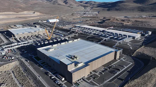 An aerial photograph looking southwest toward the Flowery Mountains of two Storey Country data centers and our gCUB generator yard.