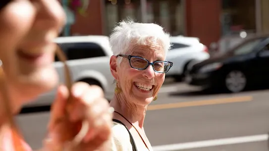 Senior lady smiling happily.