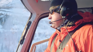 A pilot from Majestic Heli Ski flying a helicopter. 