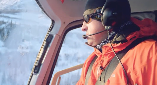 A pilot from Majestic Heli Ski flying a helicopter. 