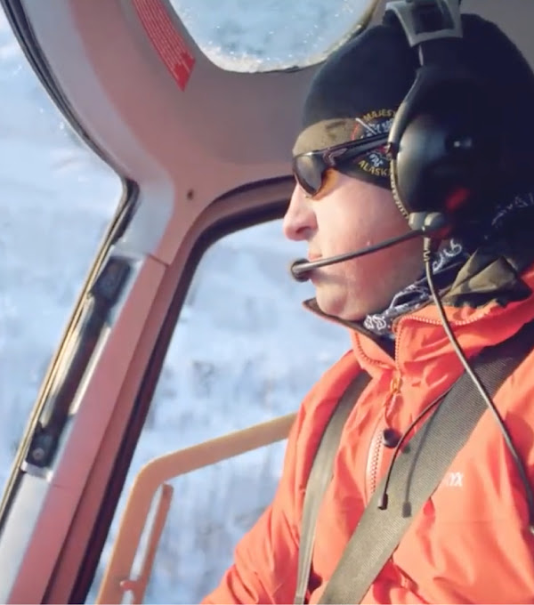 A pilot from Majestic Heli Ski flying a helicopter. 