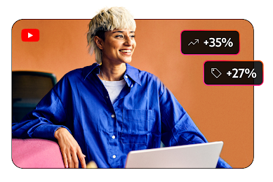 Image of a person sitting with their laptop and upward trending metrics called out in icons on the screen.