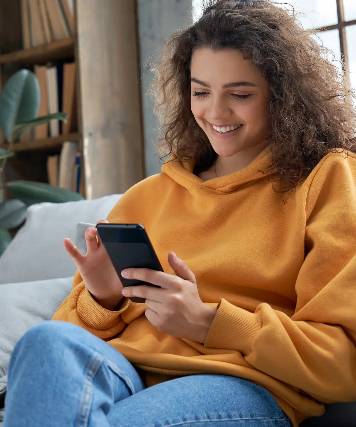 Close up of someone using their smartphone in their left hand