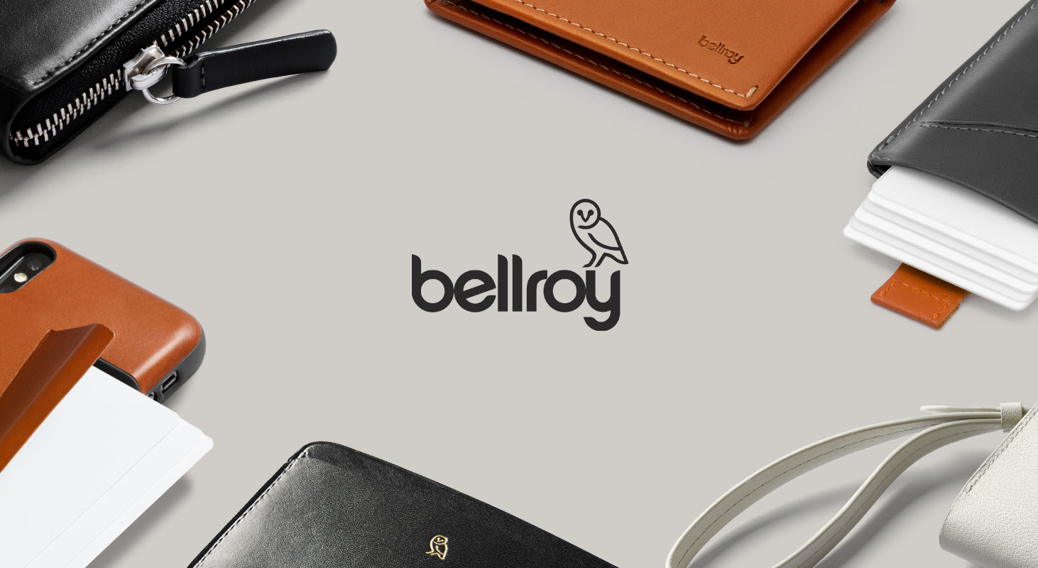 Close-up of an array of Bellroy accessories with the Bellroy logo at the center.