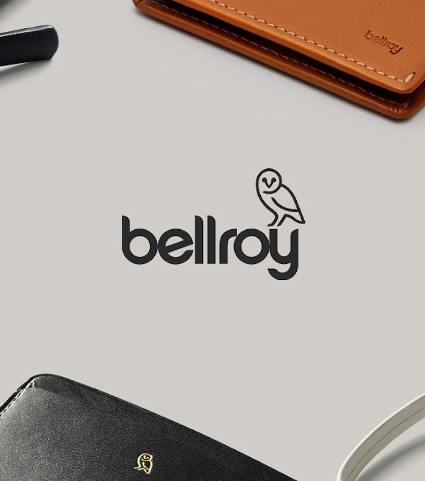 Close-up of an array of Bellroy accessories with the Bellroy logo at the centre.