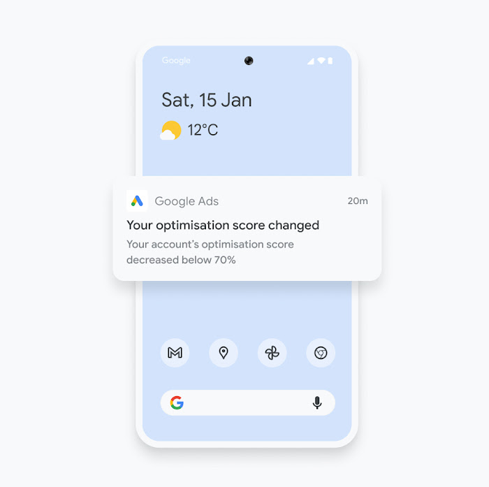 Illustration of a phone showing a Google Ads mobile app notification about an optimisation score change.