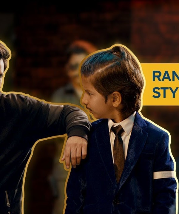 Ranbir talking to a young boy in a suit with the words Ranbir's killer style secret in the background