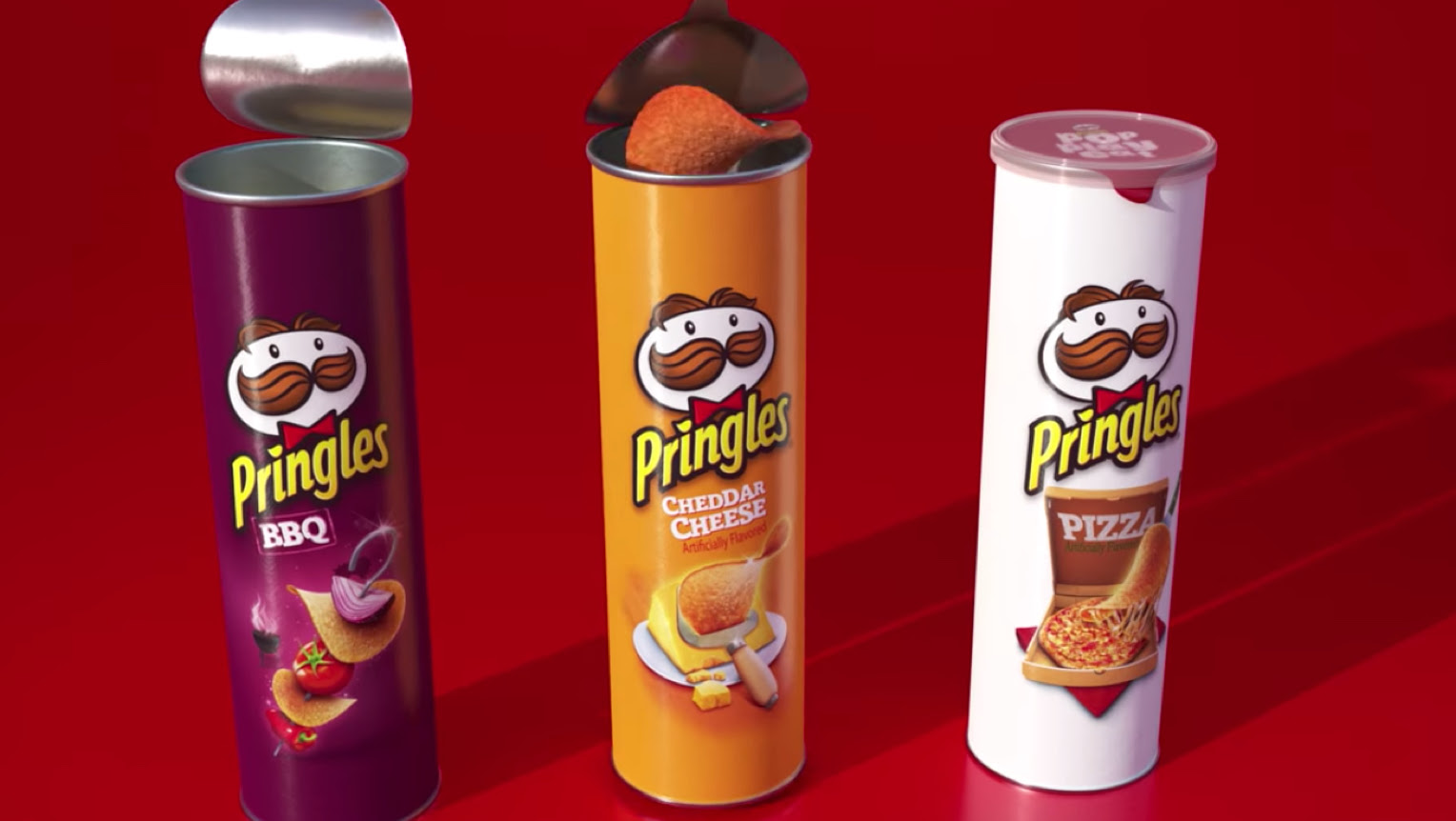 Three different Pringles chip containers lined up in a row.