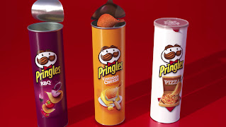 Three different Pringles chip containers lined up in a row.