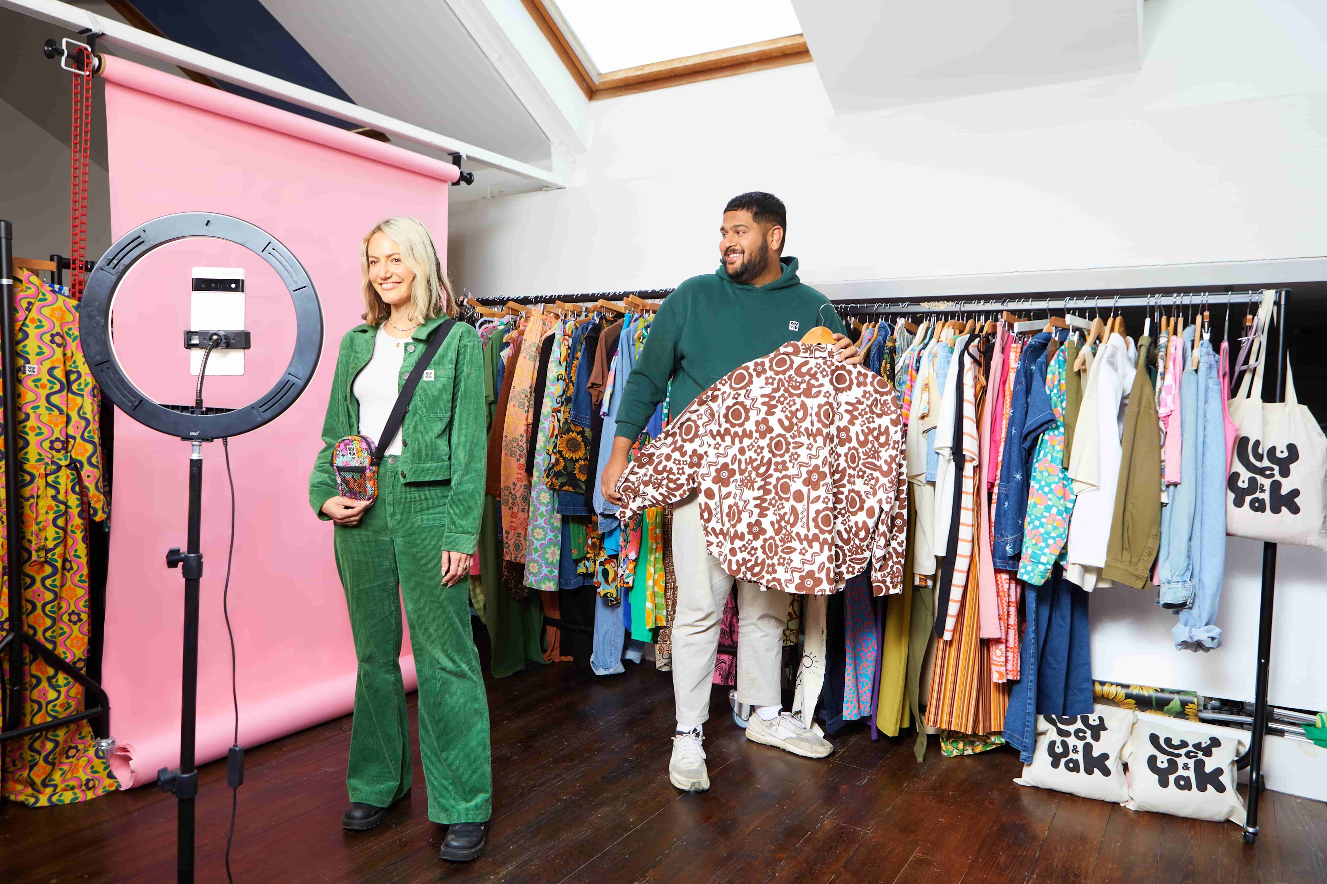 Lucy & Yak employees in a team meeting reviewing clothing