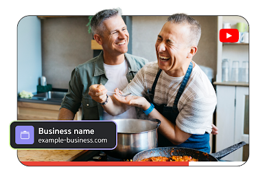 Two men laughing and cooking with ‘Business name’ called out in the corner of the screen.