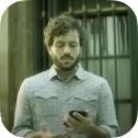 We see the image preview from a video for Oi with a person staring down at their phone.