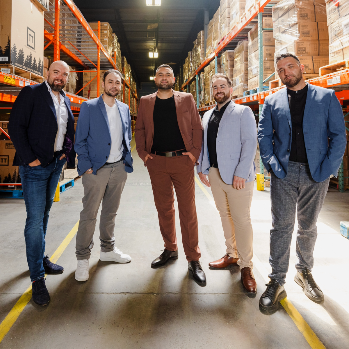 The Transformer Table team pictured in their warehouse