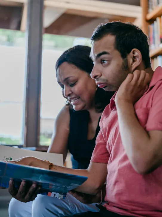 Taku and Anu read a book together at SPARC in Northern Virginia