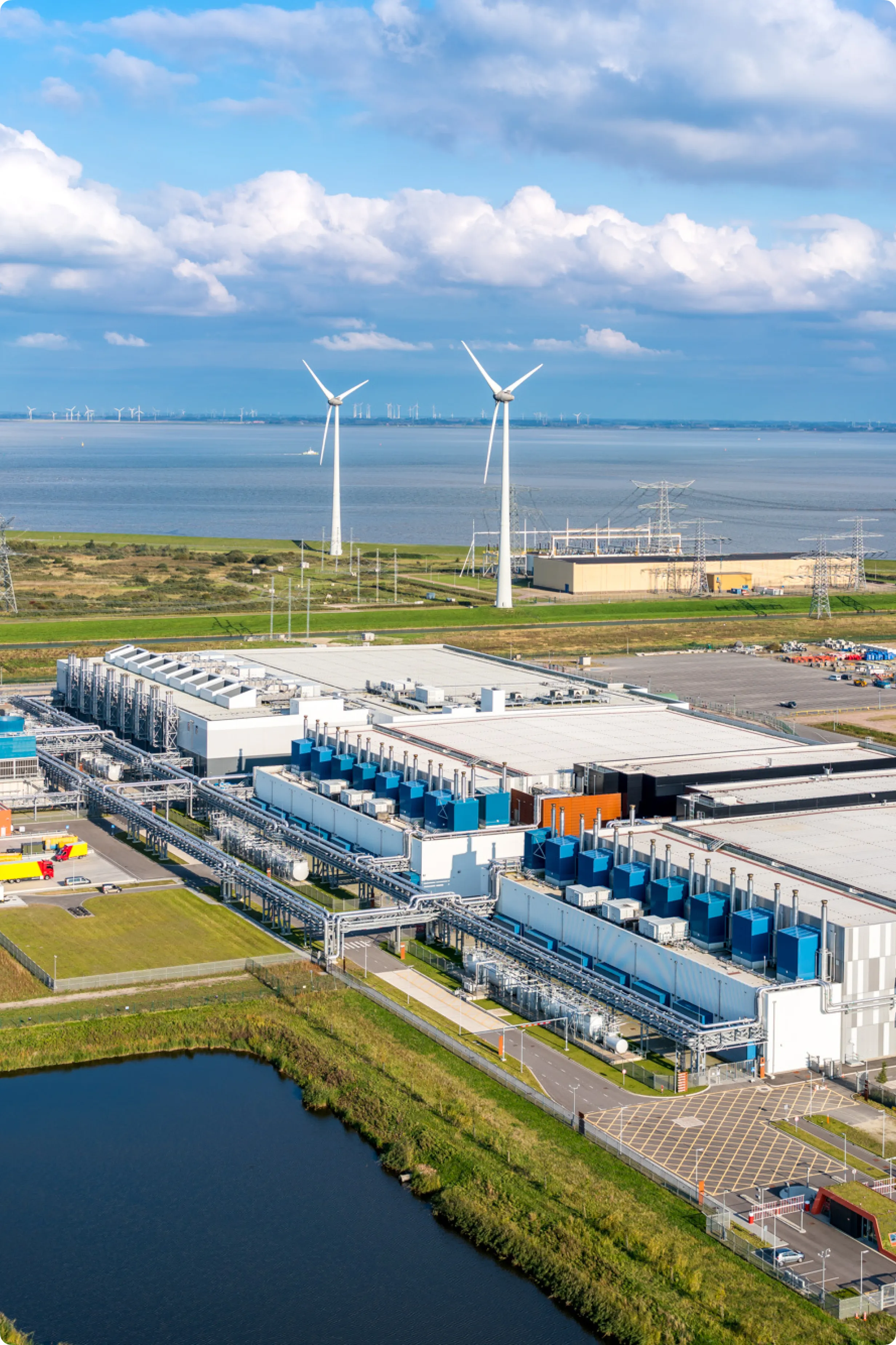 Wind turbines in the ground above a data center overlooking in the ocean