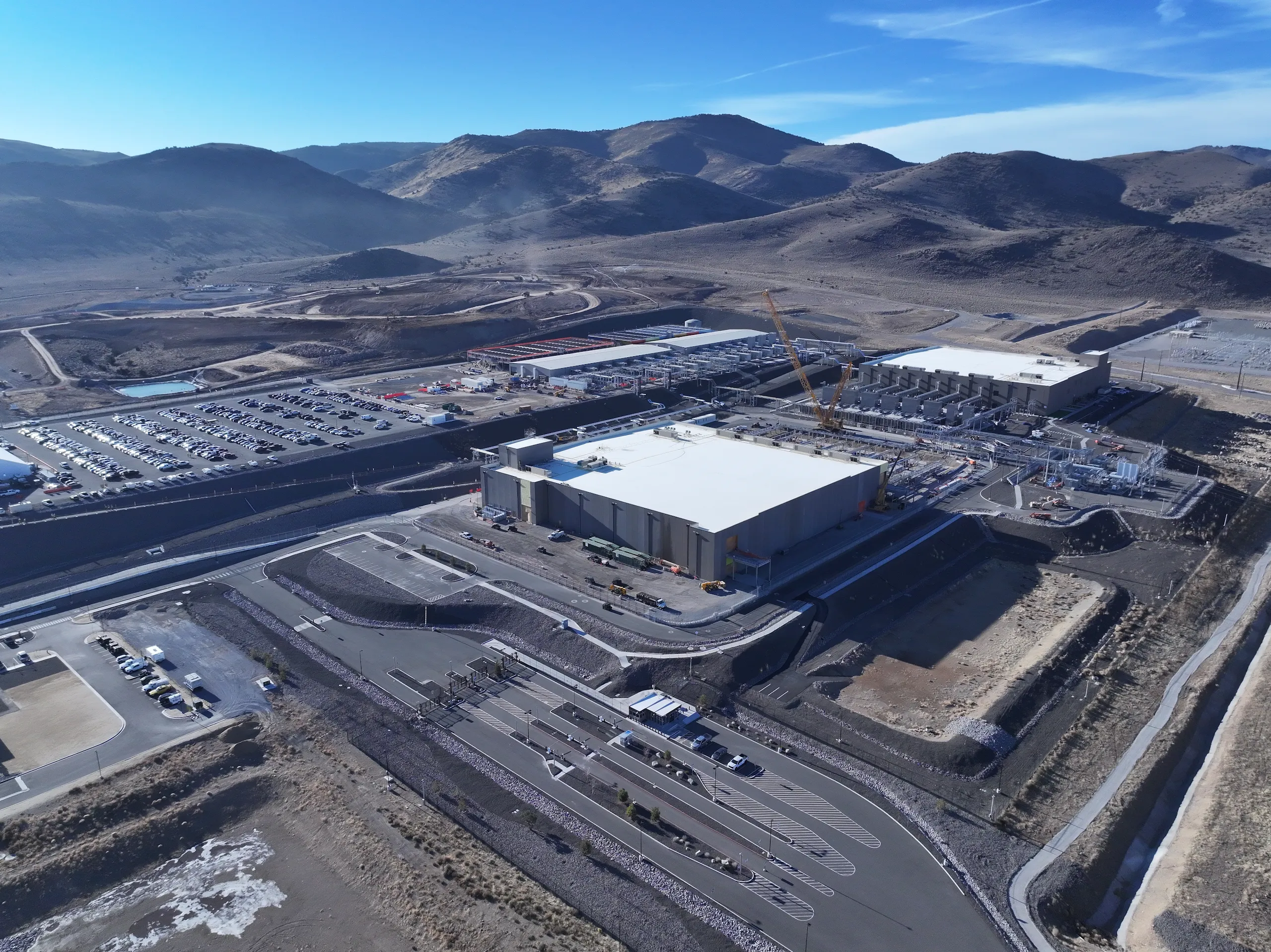 A photograph of two Storey County, Nevada, data centers surrounded by the Flowery Mountains.