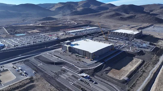 A photograph of two Storey County, Nevada, data centers surrounded by the Flowery Mountains.