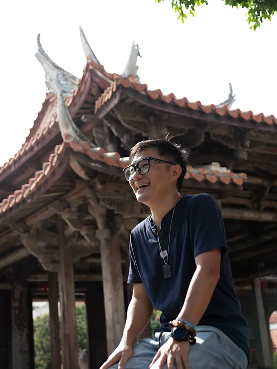 Googler Jerry Kuo sits outside a temple in Changhua County, Taiwan