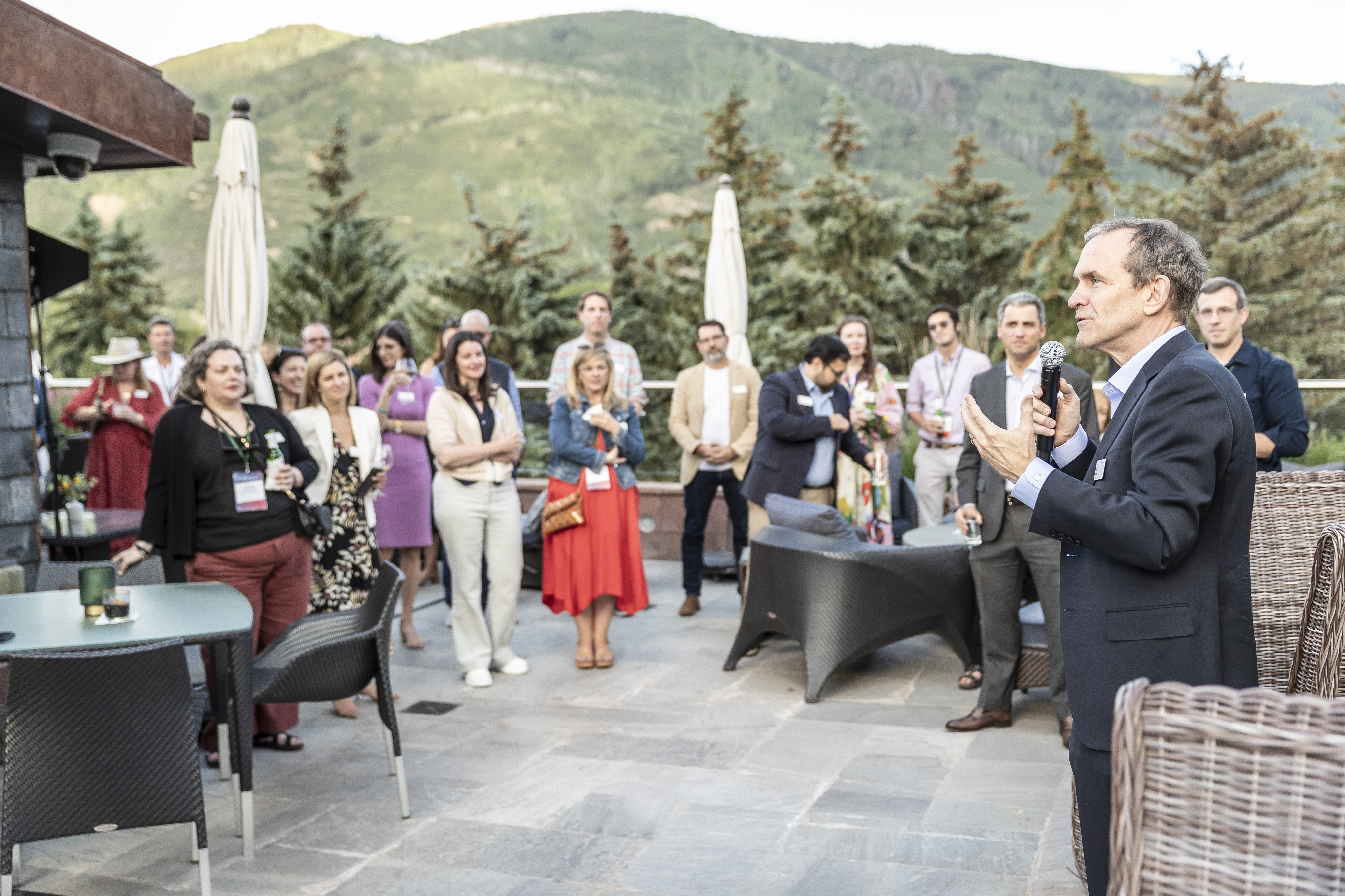Six photos of people interacting at different events at the Aspen Security Forum such as panels, breakfast, and cocktail hour.