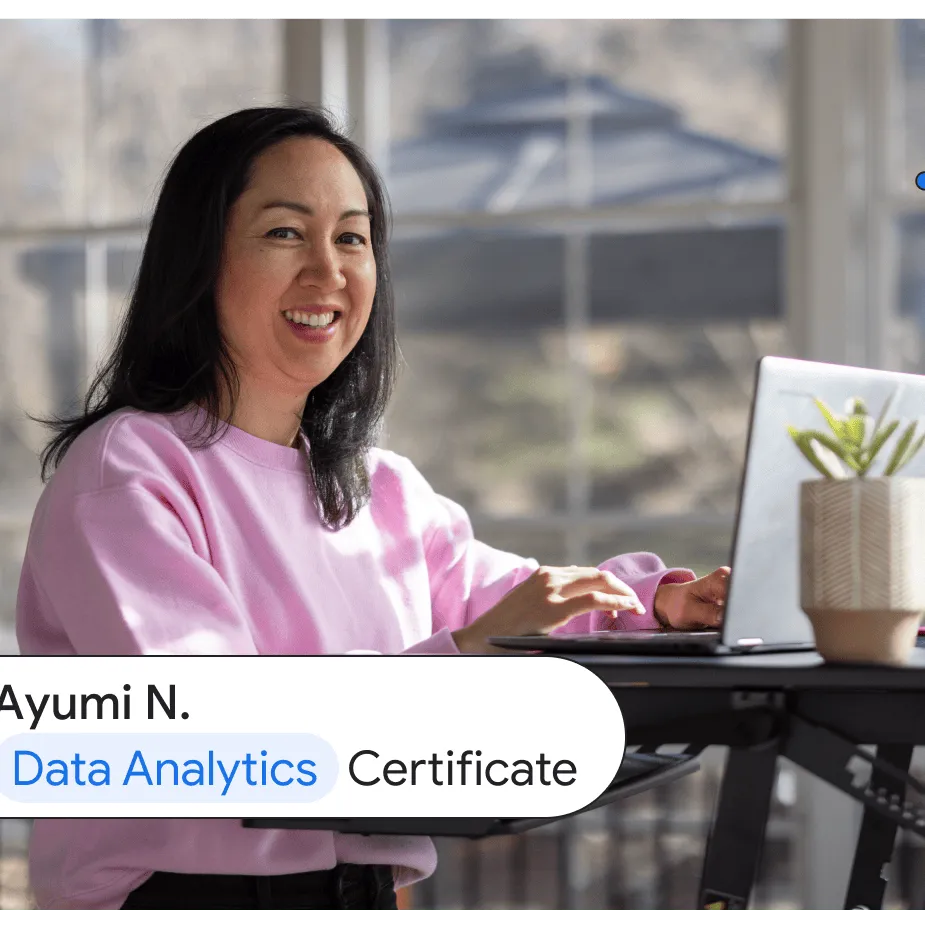 Ayumi N., a Google Data Analytics Certificate graduate, works in a brightly lit sun porch while leaning against a standing desk