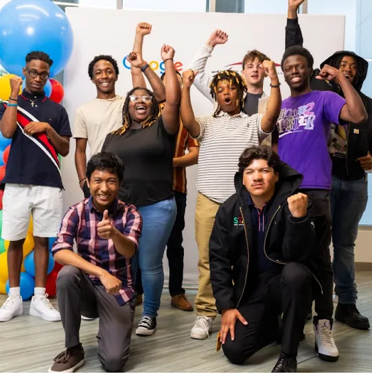 A group of excited, diverse graduates from Google’s Skilled Trades and Readiness Program in South Carolina.