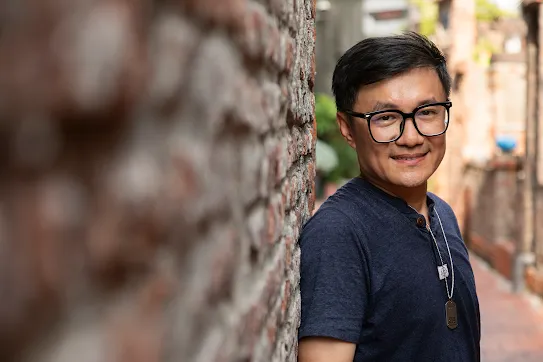 Googler Jerry Kuo stands along a brick wall in Changhua County, Taiwan