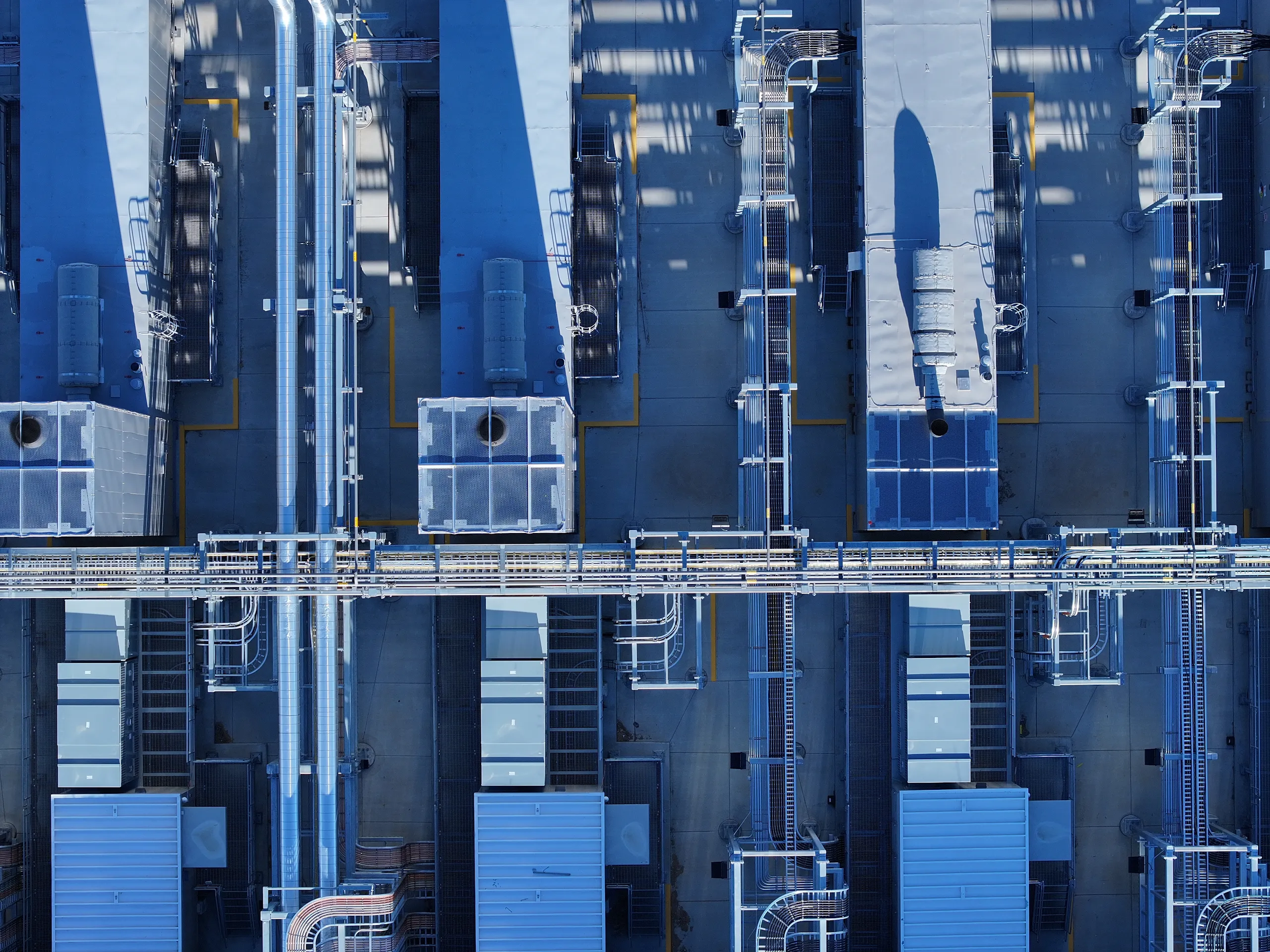 A drone photograph taken over the top of individual generators in Google's gCUB generator yard at Storey County, Nevada, data center campus.