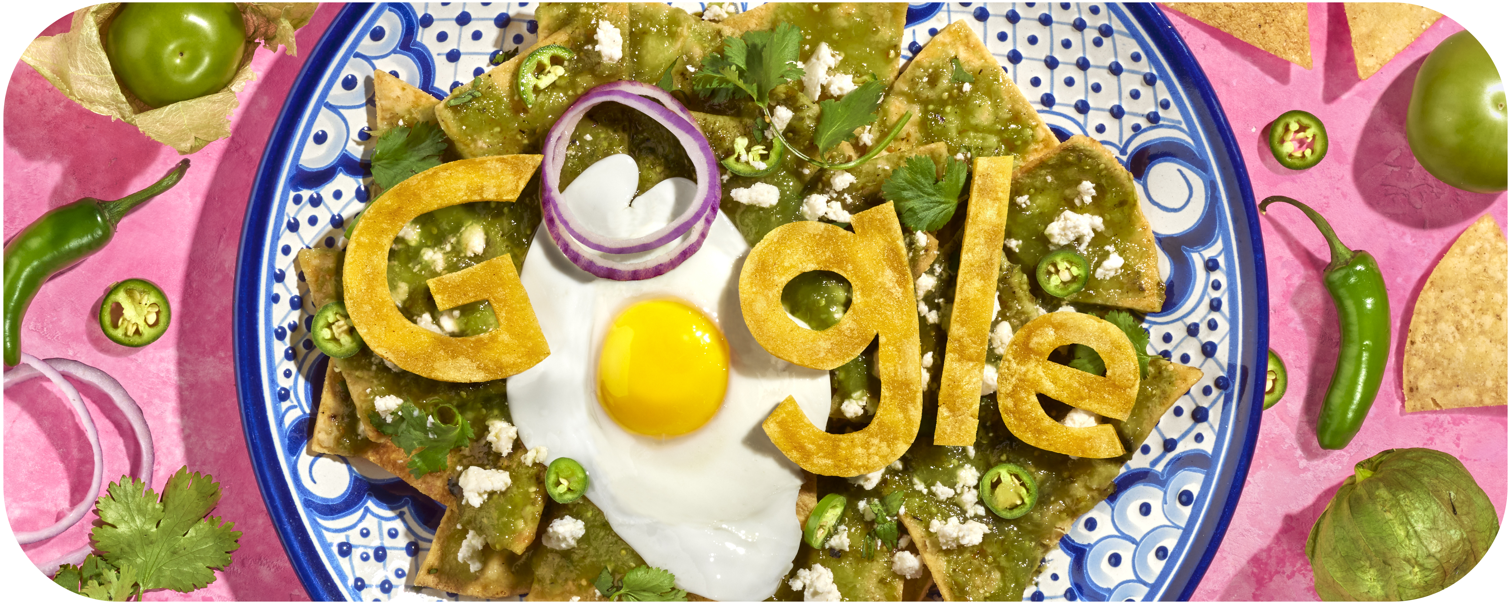 Colorful animated illustration of a plate of nachos garnished with green salsa, jalepenos and cilantro. Google letters are made out of the tortilla with the letters O made out of an onion and an egg. In the background of the illustration are more jalepenos, onions and cilantros. 