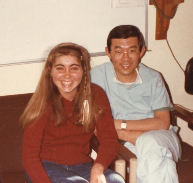 Photo of Dr. Victor Chang smiling with a young girl
